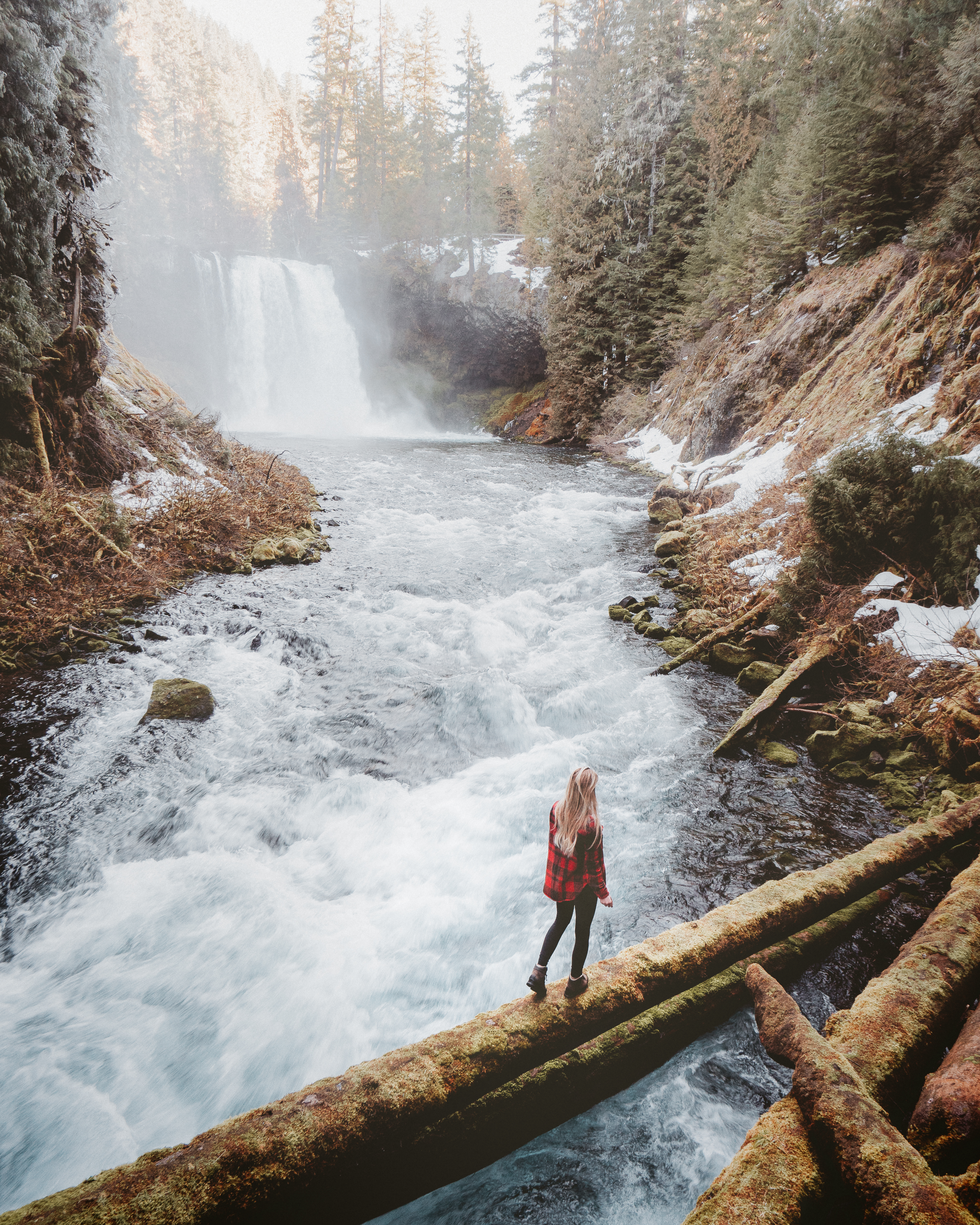 Girl hiking waterfall trail in Oregon
