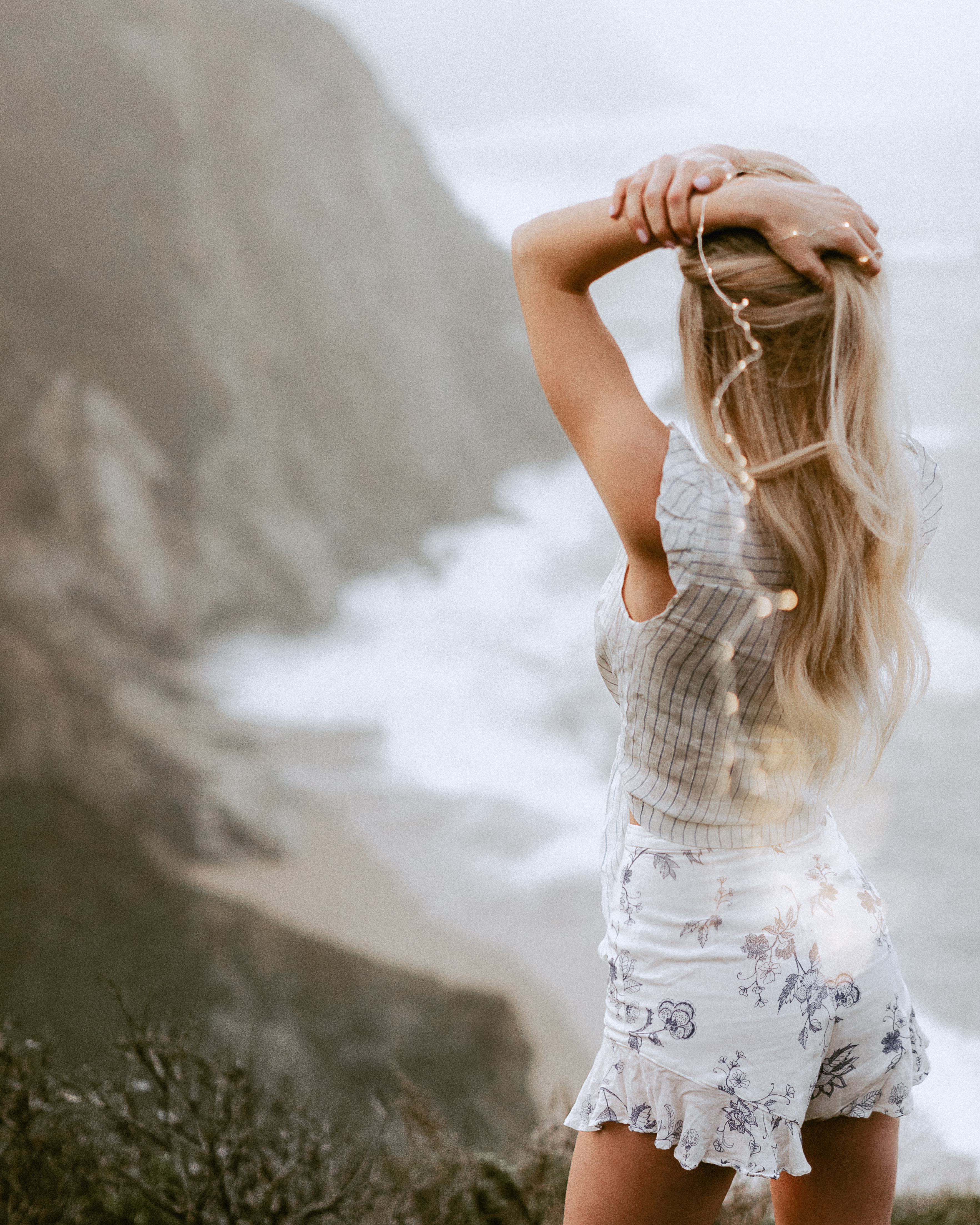VSCO Girl with Fairy Lights Overlooking Cliff In Big Sur