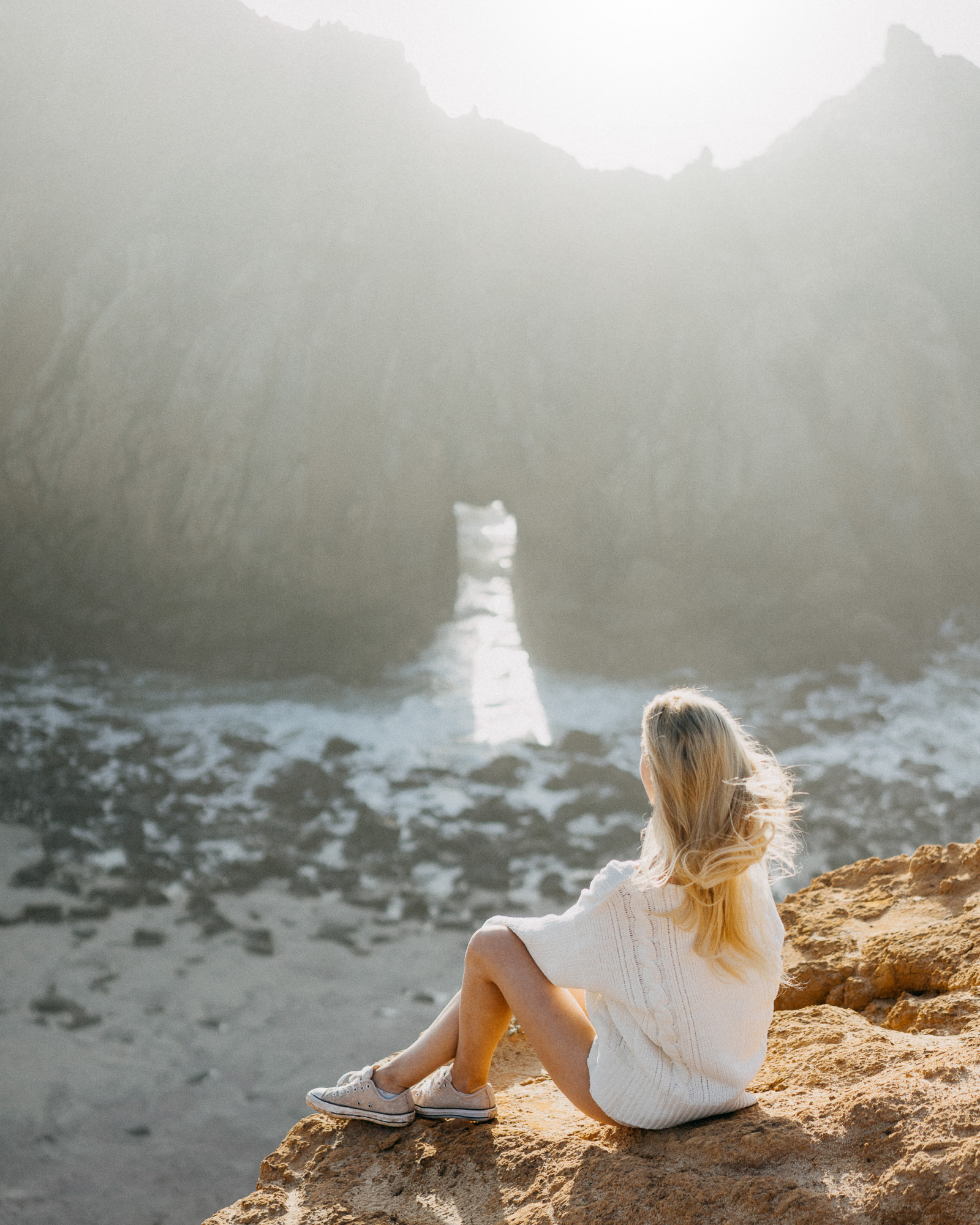 Girl Overlooking Pfeiffer beach at Sunset Big Sur California